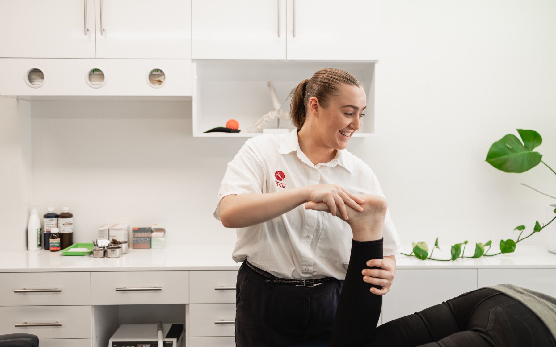 Podiatrist performing a hands-on foot and ankle assessment