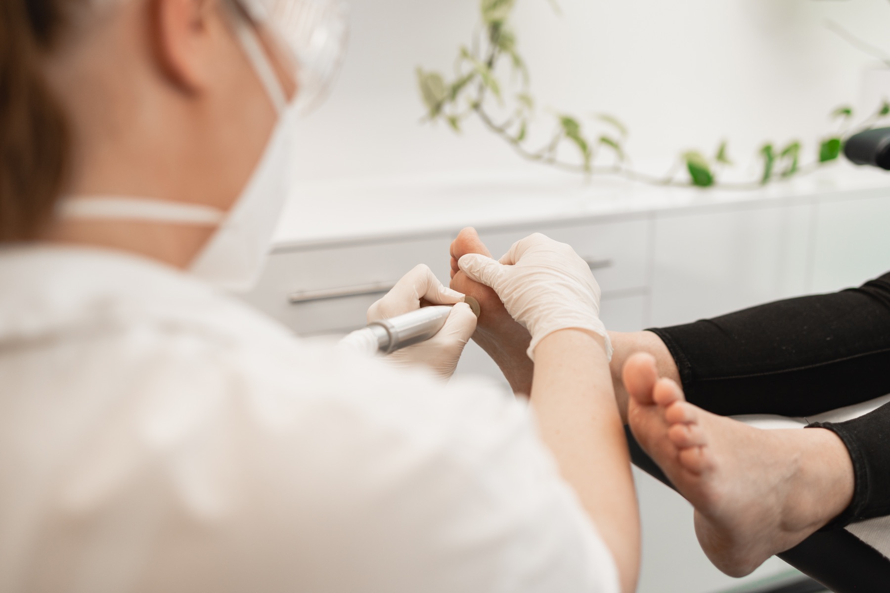Podiatrist providing routine nail and skin care at Podhealth in Adelaide