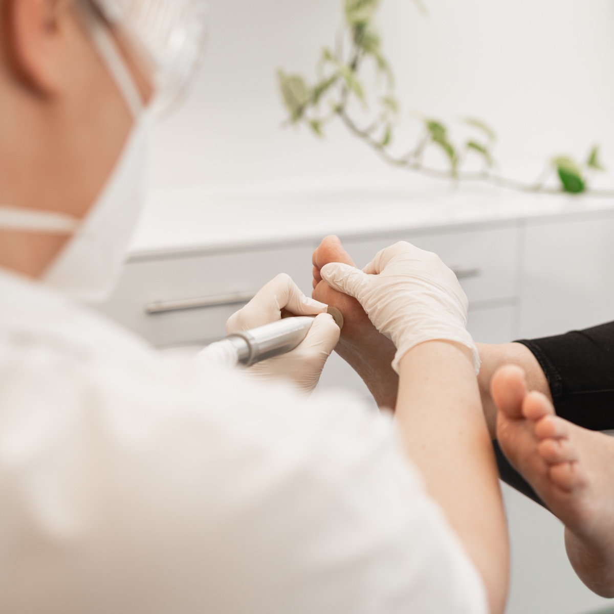 Podiatrist treating a patient during a home visit in Adelaide